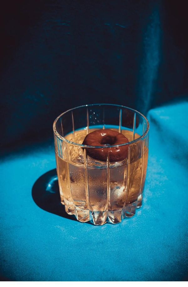 Rolo de Coco cocktail with chocolate donut garnish