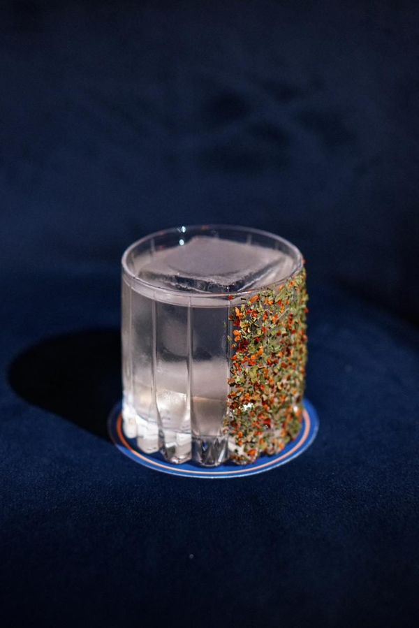 Margarita-style cocktail with herb and chili rim